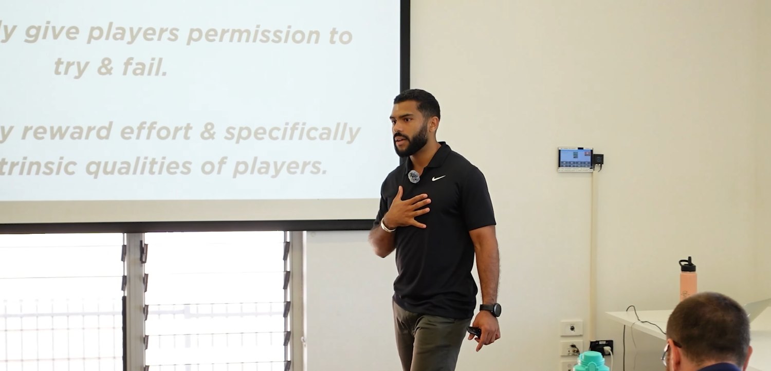 Nick Marr, founder of PlayFree, hand on heart at a workshop