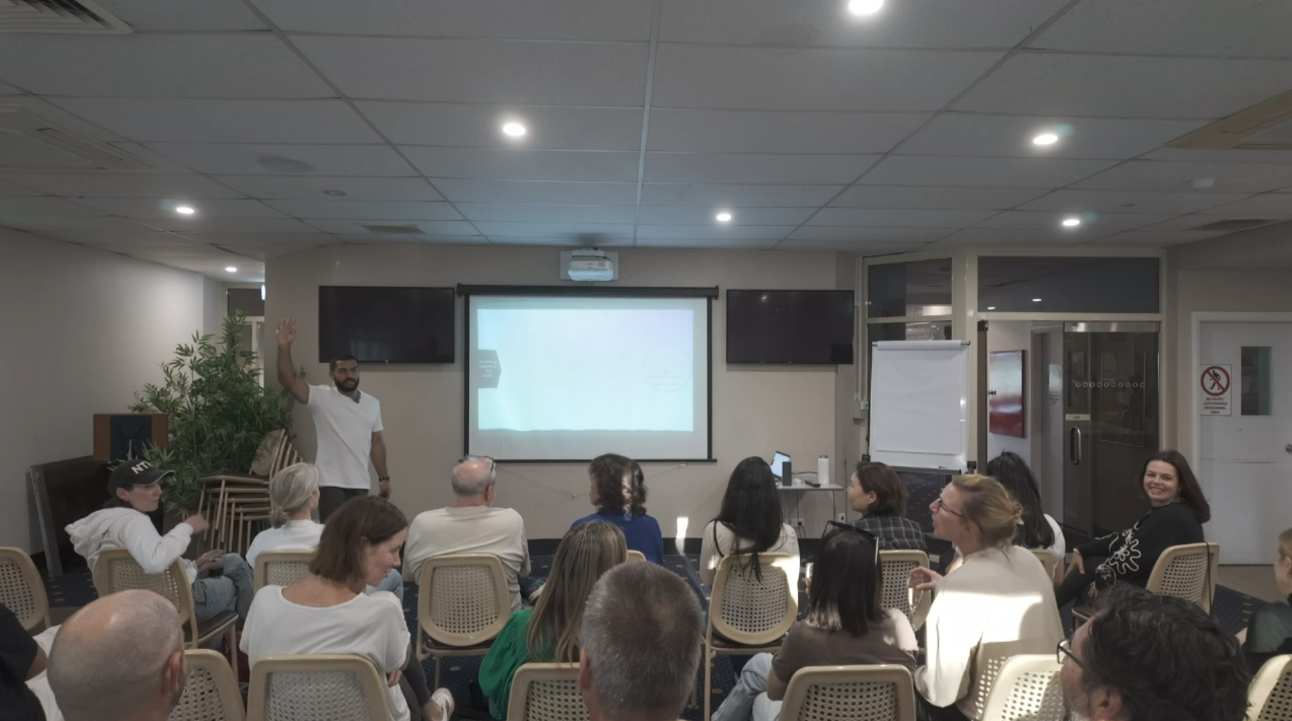 Parents leaning in, engaged, at a live PlayFree workshop